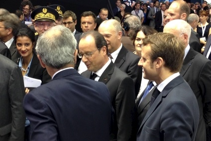 Faurecia CEO, Yann Delabriere (l) with President Francois Hollande, at the Paris Motor Show